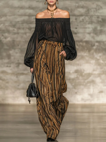 Elegant black off-the-shoulder top and striped wide-leg trousers set